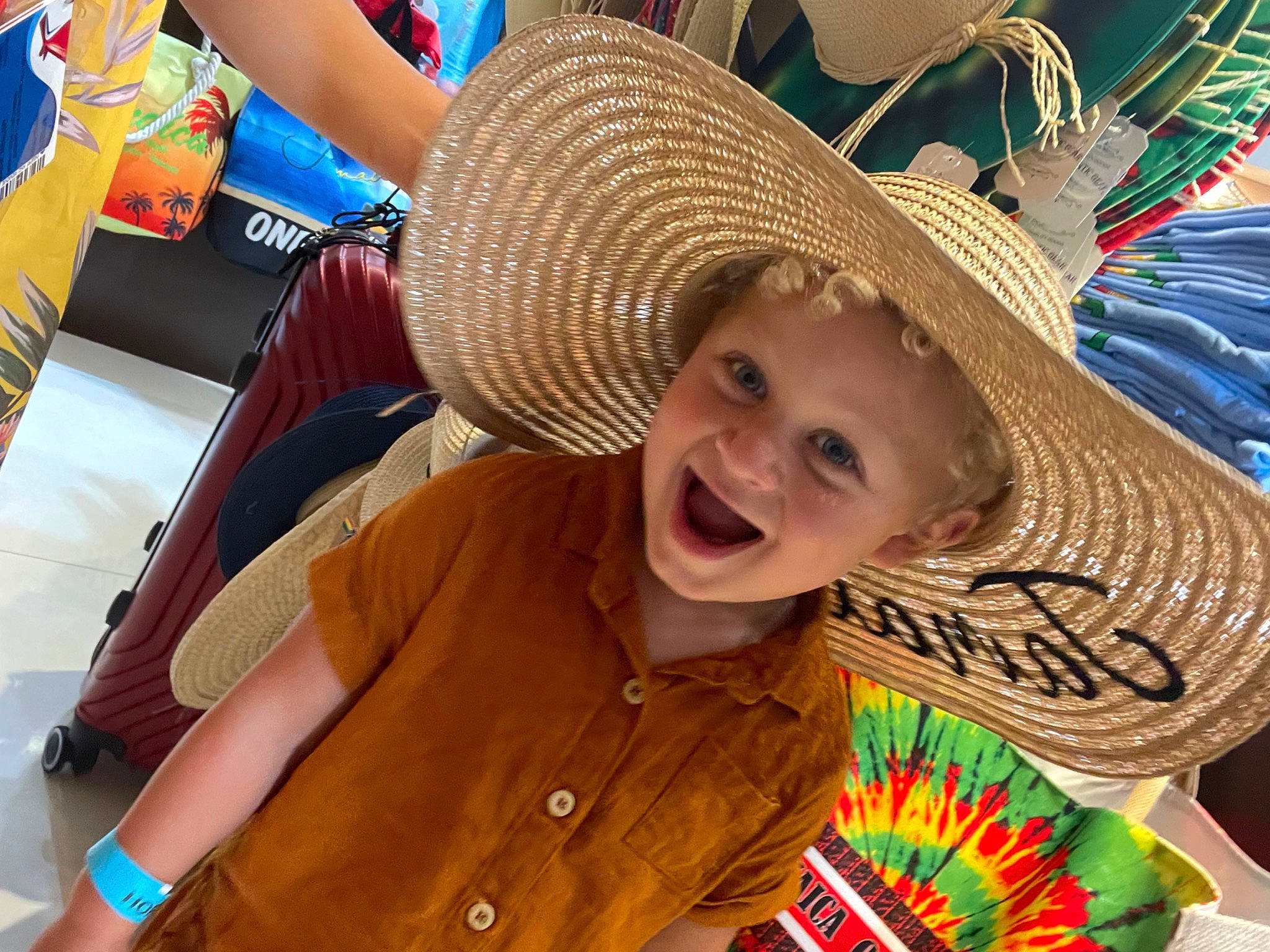 Nathan is registered to the contest to win money with this photo: cap, child, costume_hat, cowboy_hat, event, fashion_accessory, fedora, fun, grass, happy, hat, headgear, headwear, laugh, leisure, person, recreation, smile, sombrero, summer