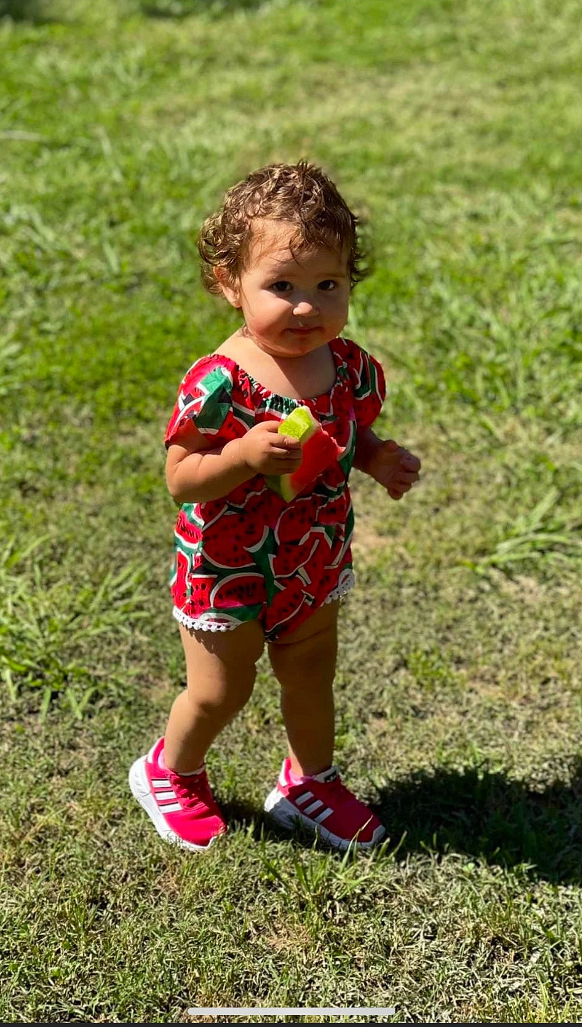 Macie joined the competition — help win amazing prizes! baby, baby_toddler_clothing, face, footwear, fun, grass, grassland, happy, human_leg, leisure, meadow, pattern, people_in_nature, person, plant, recreation, shoe, shorts, sitting, sneakers