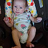 Raelynn is registered to the contest to win money with this photo: baby, blue_eyes, car_seat, child, clothing, cute, expression, floral, hands, headrest, indoor, infant, legs, looking, newborn, onesie, person, seat, small, strawberry_pattern