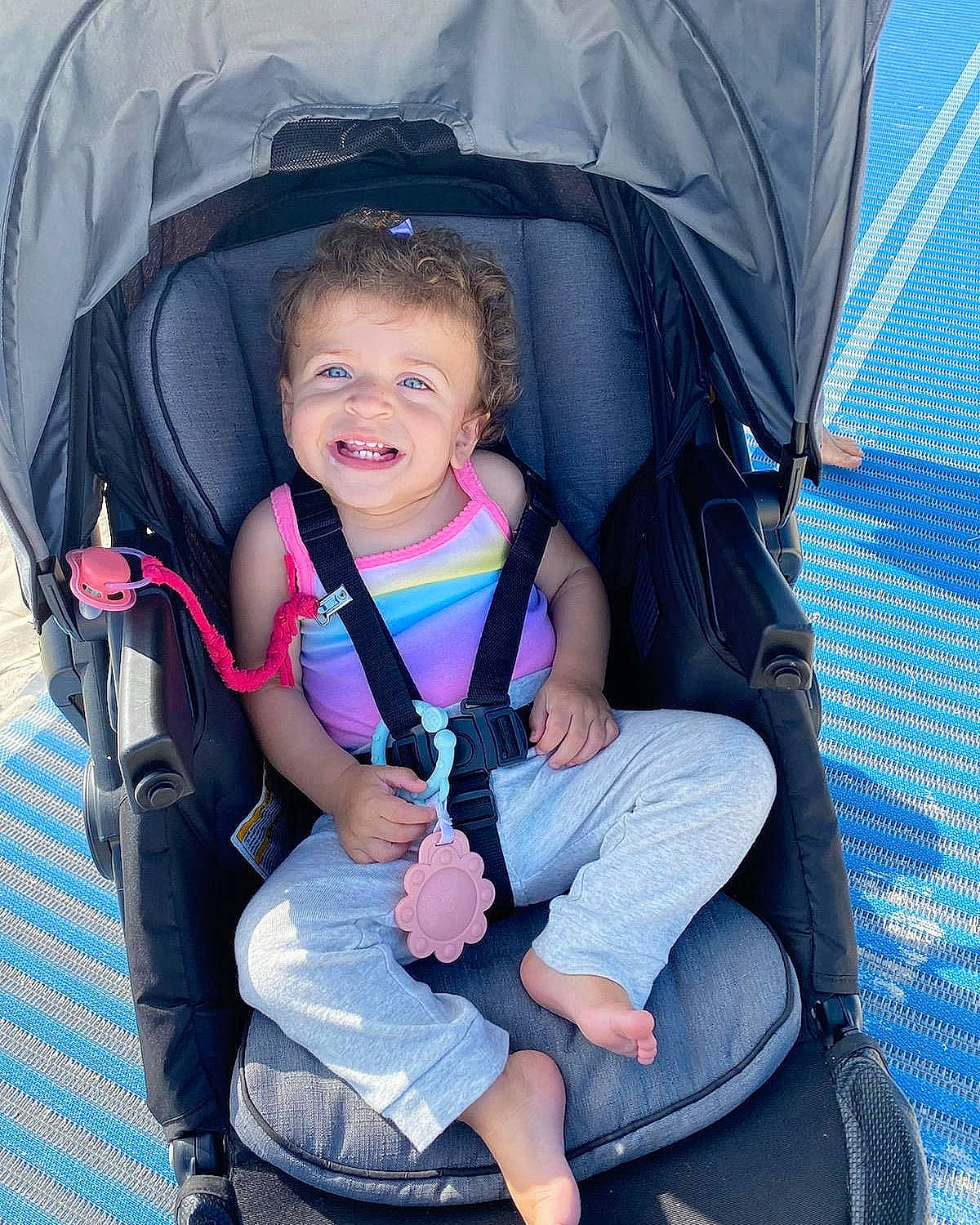 Nova Rae joined the competition — help win amazing prizes! auto_part, baby_carriage, baby_products, baby_toddler_clothing, blue, camping, child, comfort, electric_blue, fun, grass, joy, lap, leisure, person, recreation, sitting, smile, sneakers, tent