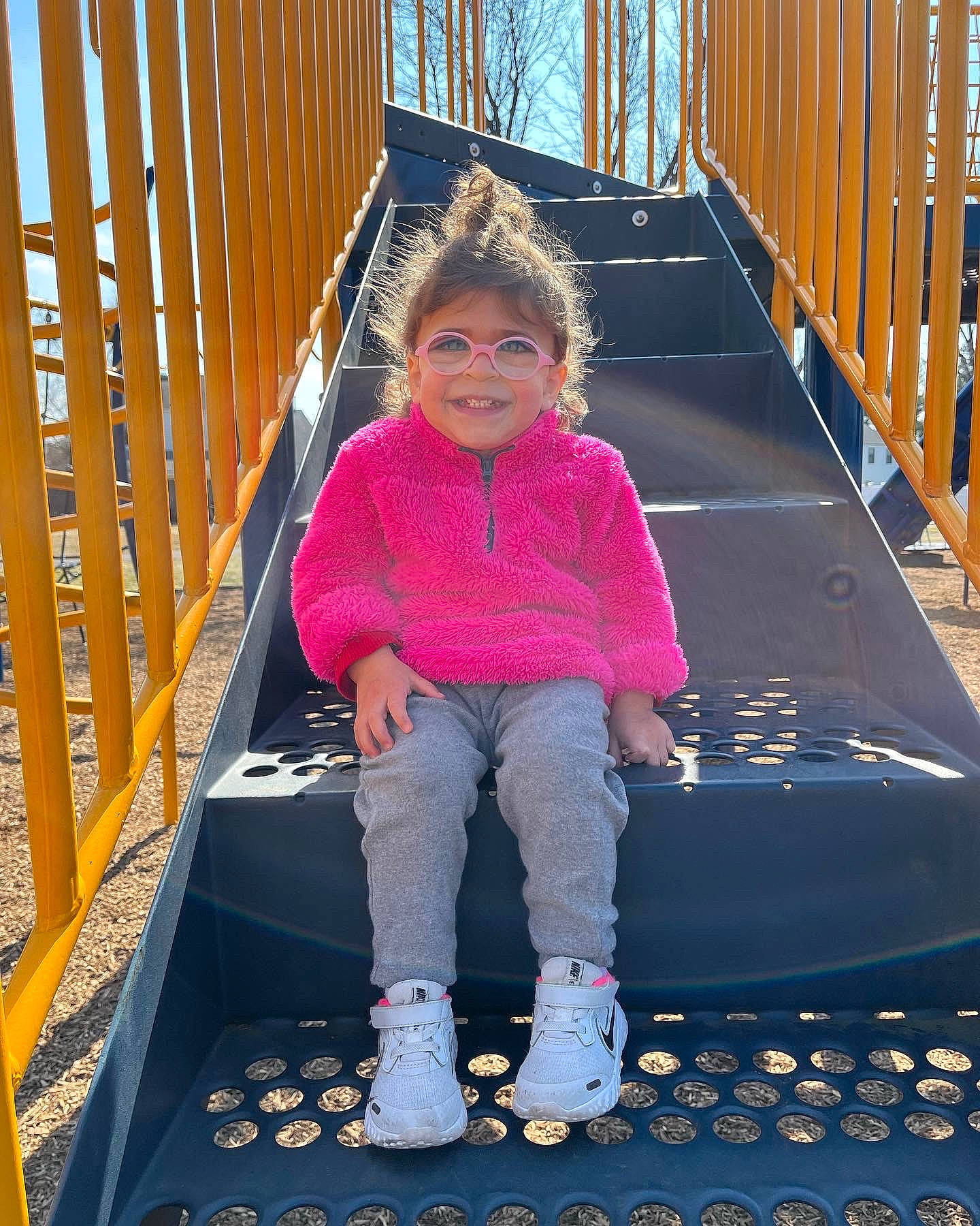 Nova Rae is registered to the contest to win money with this photo: child, electric_blue, fun, handrail, joy, leg, leisure, magenta, outdoor_play_equipment, person, play, playground, purple, recreation, smile, sneakers, stairs, standing, toddler, travel
