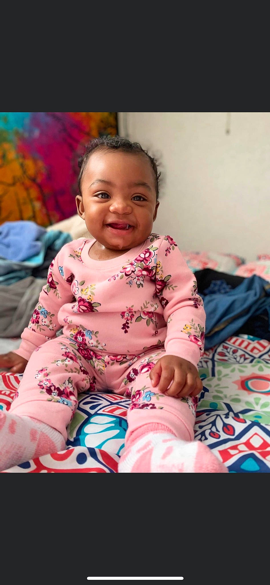 Jewel is registered to the contest to win money with this photo: baby, baby_toddler_clothing, cheek, child, chin, comfort, fun, happy, head, iris, joy, magenta, pattern, person, pink, purple, sitting, skin, sleeve, smile