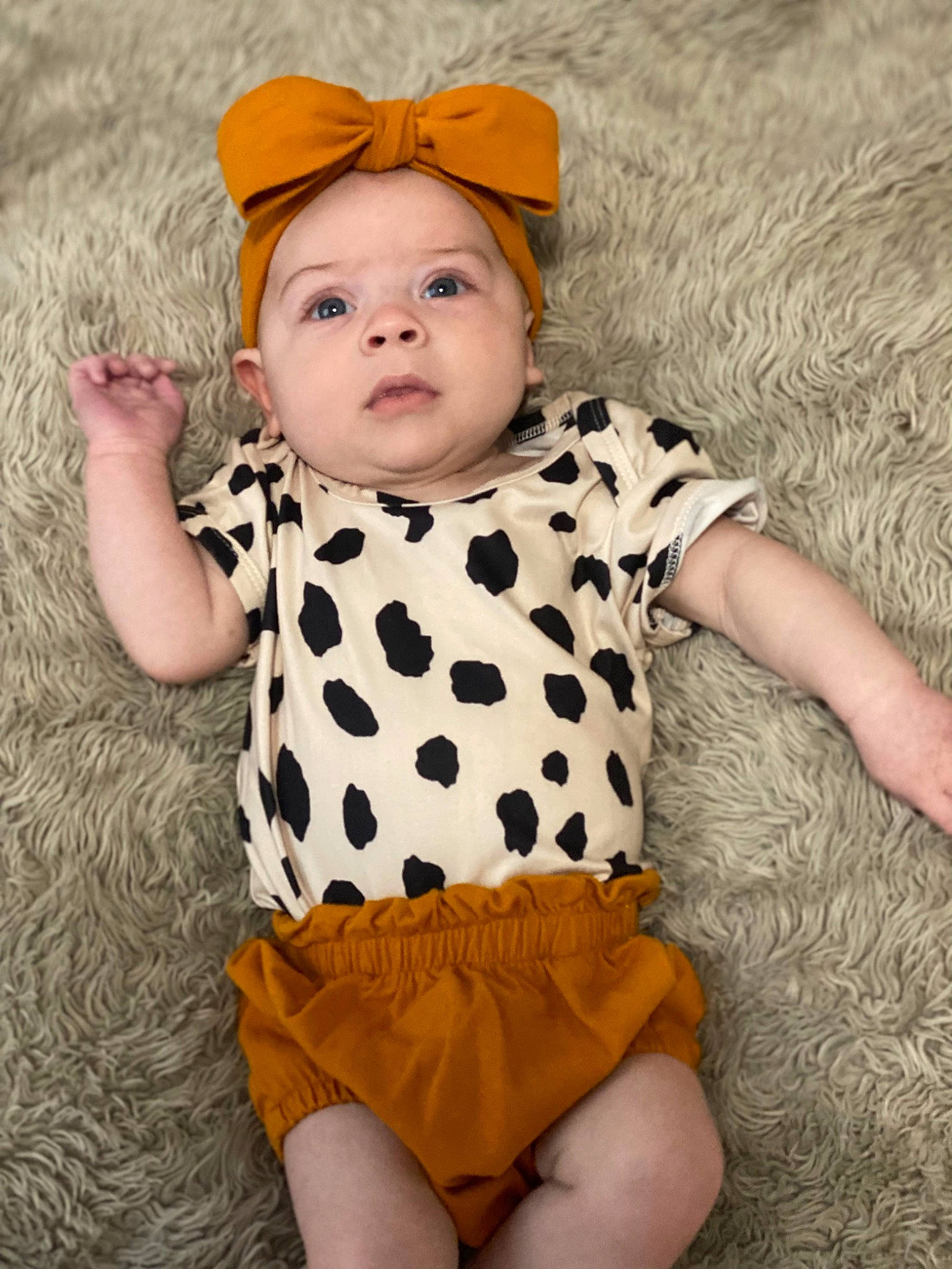 Brynley is registered to the contest to win money with this photo: arm, baby, baby_toddler_clothing, day_dress, eye, face, happy, head, headgear, human_body, pattern, people_in_nature, person, photograph, skin, sleeve, t_shirt, toddler, trunk, waist