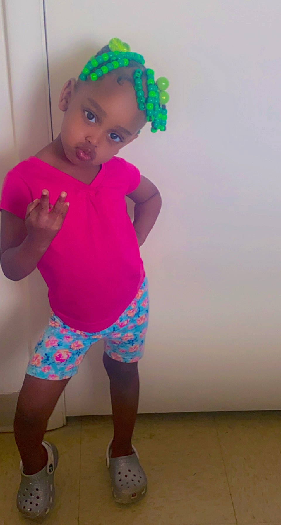 Janiya is registered to the contest to win money with this photo: abdomen, active_pants, baby_toddler_clothing, chest, face, hair, happy, head, knee, leg, neck, person, pink, purple, shorts, sleeve, sportswear, thigh, toddler, trunk