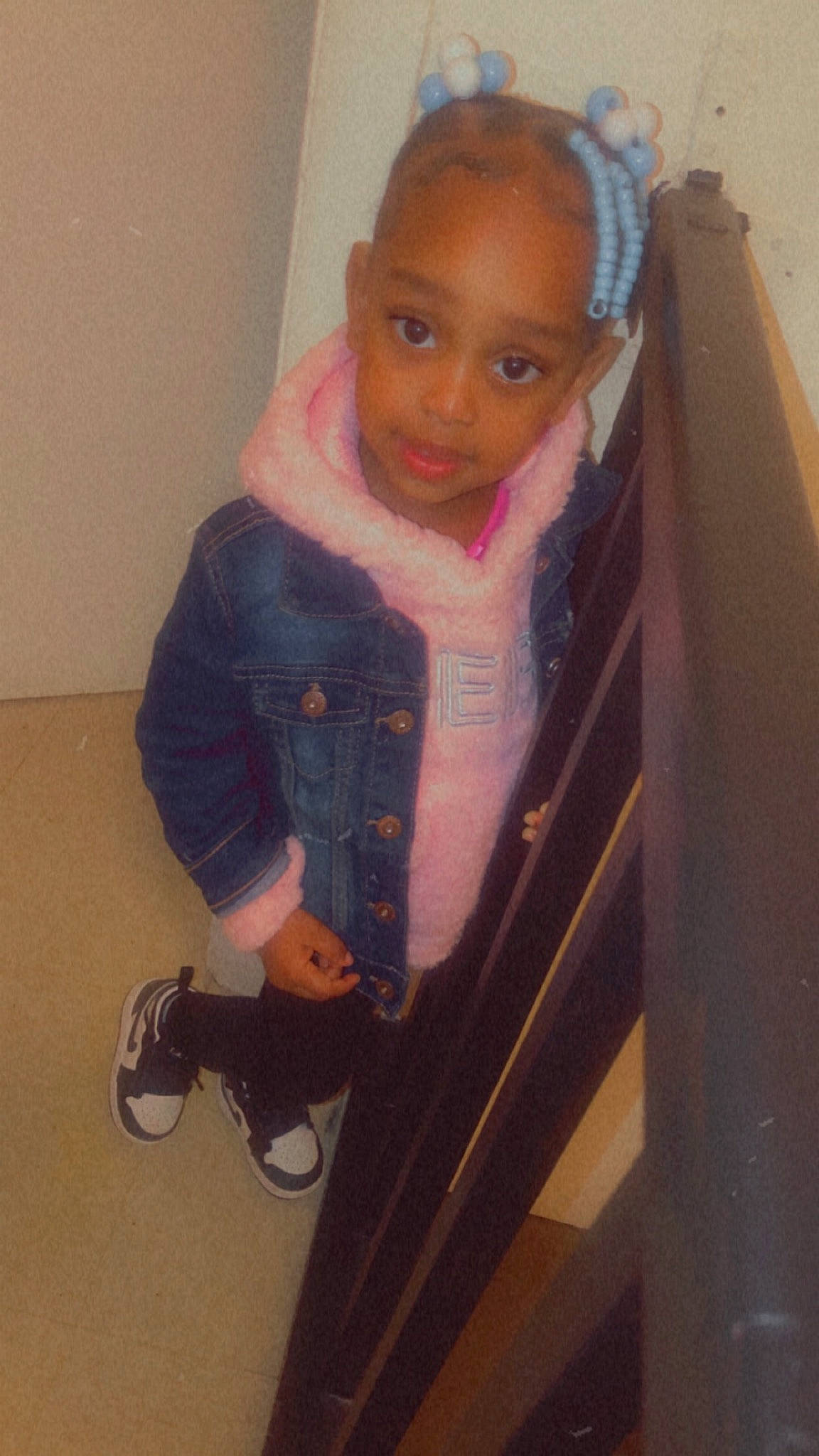 Janiya is registered to the contest to win money with this photo: baby_products, baby_toddler_clothing, chair, child, denim, face, floor, flooring, fun, human_body, iris, jacket, knee, pattern, person, sitting, sleeve, stairs, t_shirt, toddler