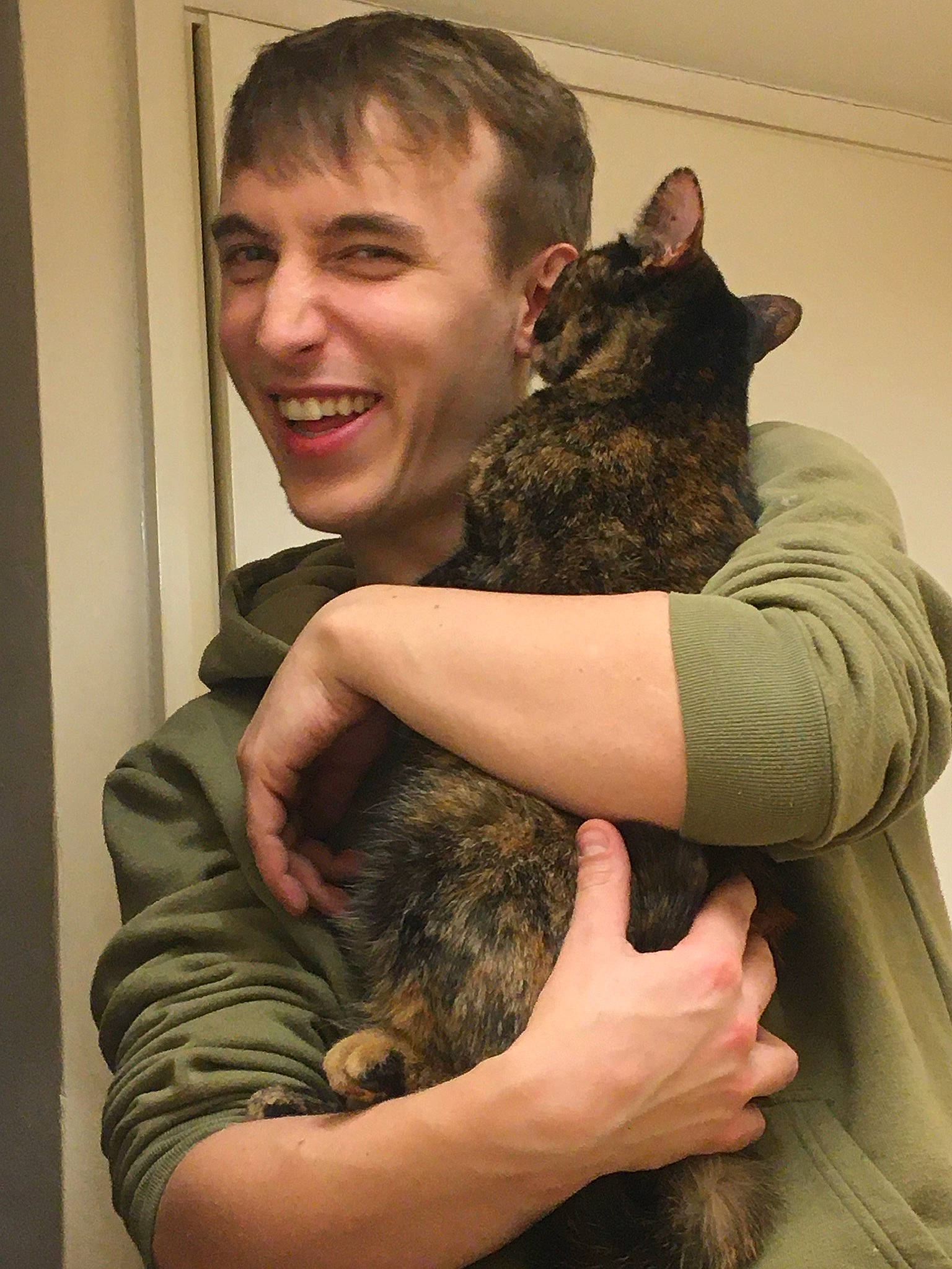 Babushka is registered to the contest to win money with this photo: canidae, carnivore, cat, chinchilla, ear, felidae, fur, gesture, hug, mammal, small_to_medium_sized_cats