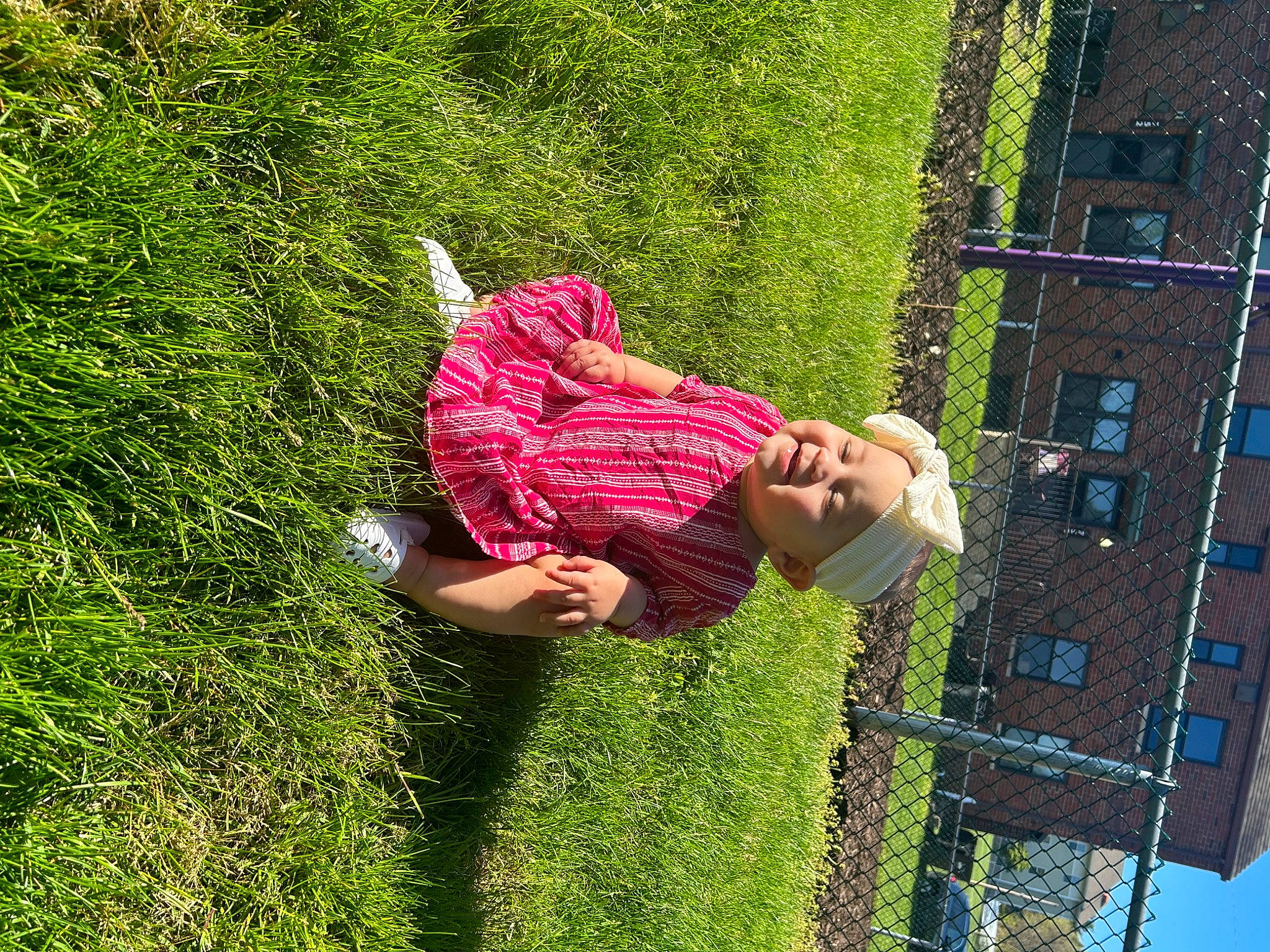 Estella joined the competition — help win amazing prizes! fun, garden, grass, grassland, groundcover, happy, headwear, leisure, magenta, mesh, net, people_in_nature, person, plant, recreation, rope, shrub, sky, toddler, tree