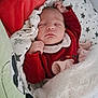 baby, sleeping, blanket, red_clothing, infant, cozy, bed, comfort, cute, newborn, soft, face, peaceful, rest, child, wrapped, plush_toy, pattern, star, head