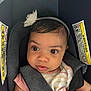Waverly joined the competition — help win amazing prizes! baby, infant, car_seat, headband, flower, bib, straps, safety, child, curious, wide_eyes, clothing, seatbelt, close_up, portrait, cute, young_child, indoor, person, seat
