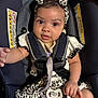 baby, infant, car_seat, headband, leopard_print, clothing, pacifier, straps, cute, child, person, sitting, smiling, looking_at_camera, indoor, portrait, young_child, hand, face, accessory