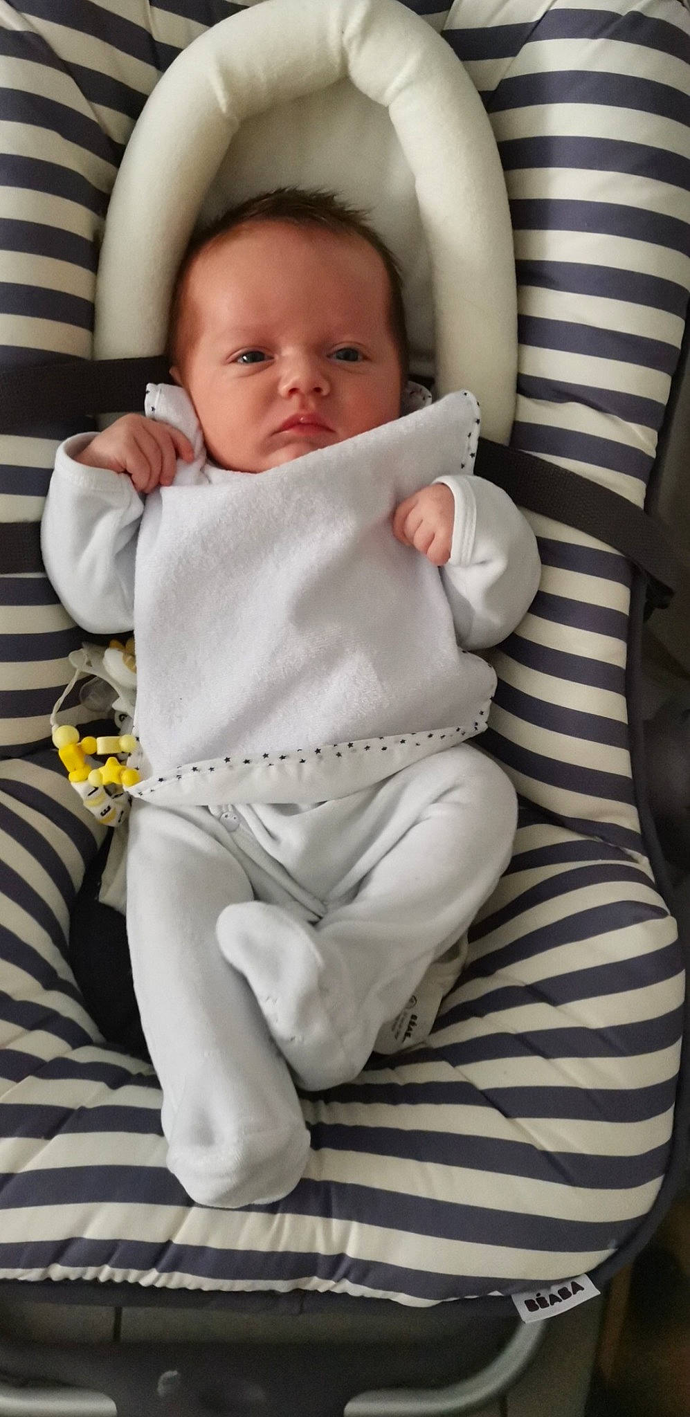 Gabriel participe au concours pour gagner de l'argent avec cette photo : baby, baby_products, baby_sleeping, baby_toddler_clothing, chair, cheek, child, comfort, foot, human_leg, knee, lap, linens, pattern, person, sitting, skin, sleeve, thigh, thumb