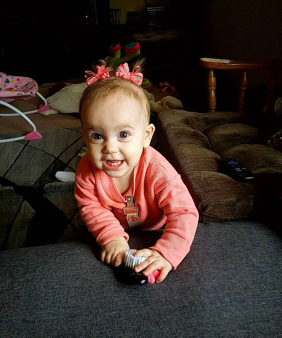 Halle is registered to the contest to win money with this photo: arm, baby, cheek, child, crawling, ear, eye, face, flooring, fun, head, joy, person, photography, pink, play, sitting, skin, smile, snapshot