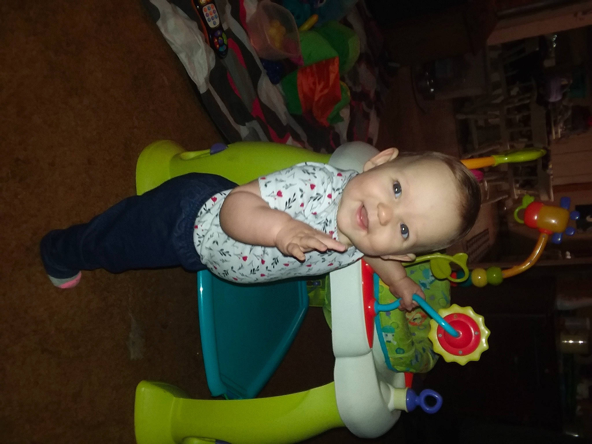 Autumn is registered to the contest to win money with this photo: baby, baby_products, baby_toddler_clothing, child, comfort, costume, event, facial_expression, flooring, fun, happy, joy, person, room, sitting, smile, toddler