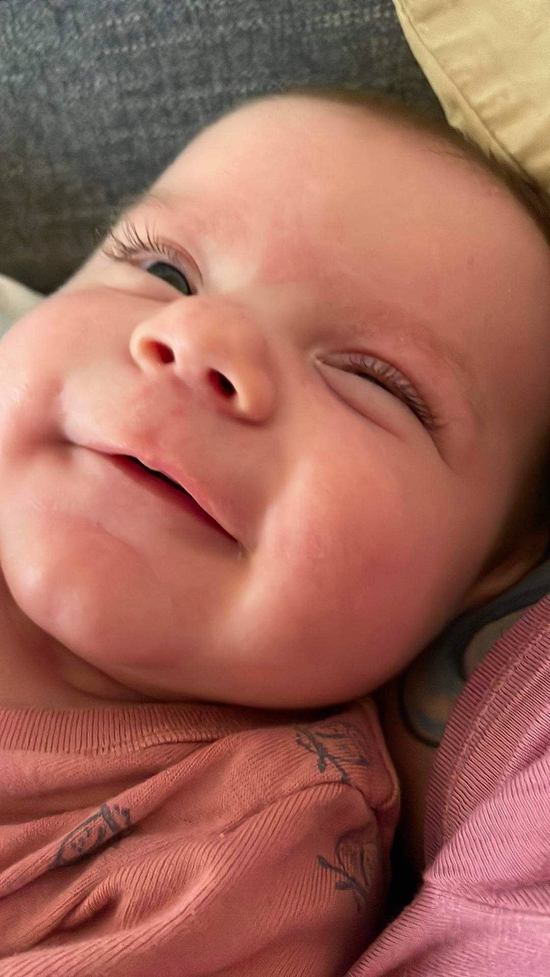 Catherine is registered to the contest to win money with this photo: baby, bedtime, cheek, child, chin, close_up, comfort, eyebrow, eyelash, finger, gesture, grass, happy, lip, mouth, nose, person, skin, smile, thumb