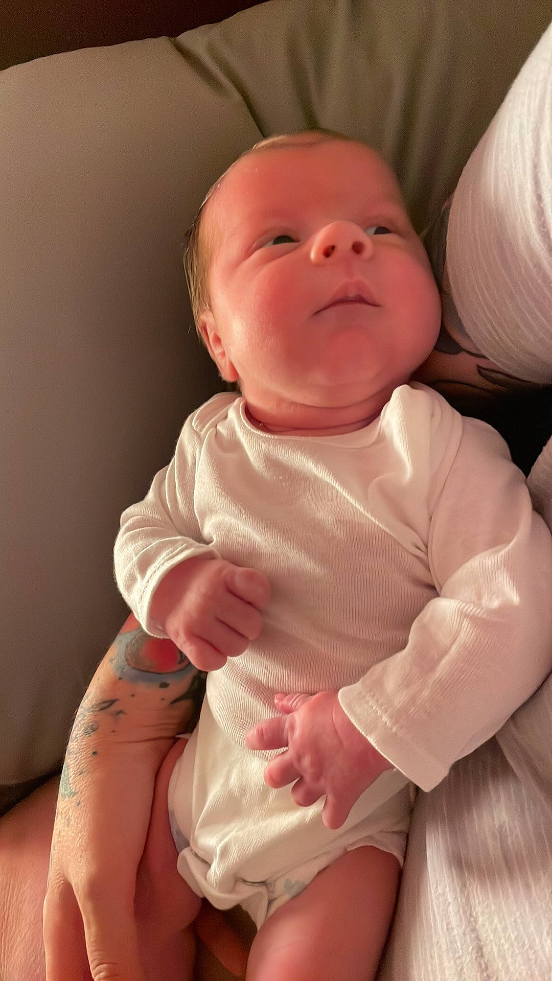 Catherine is registered to the contest to win money with this photo: arm, baby, baby_toddler_clothing, cheek, chin, comfort, finger, gesture, head, human_body, joint, lip, mouth, neck, nose, person, pink, skin, sleeve, stomach
