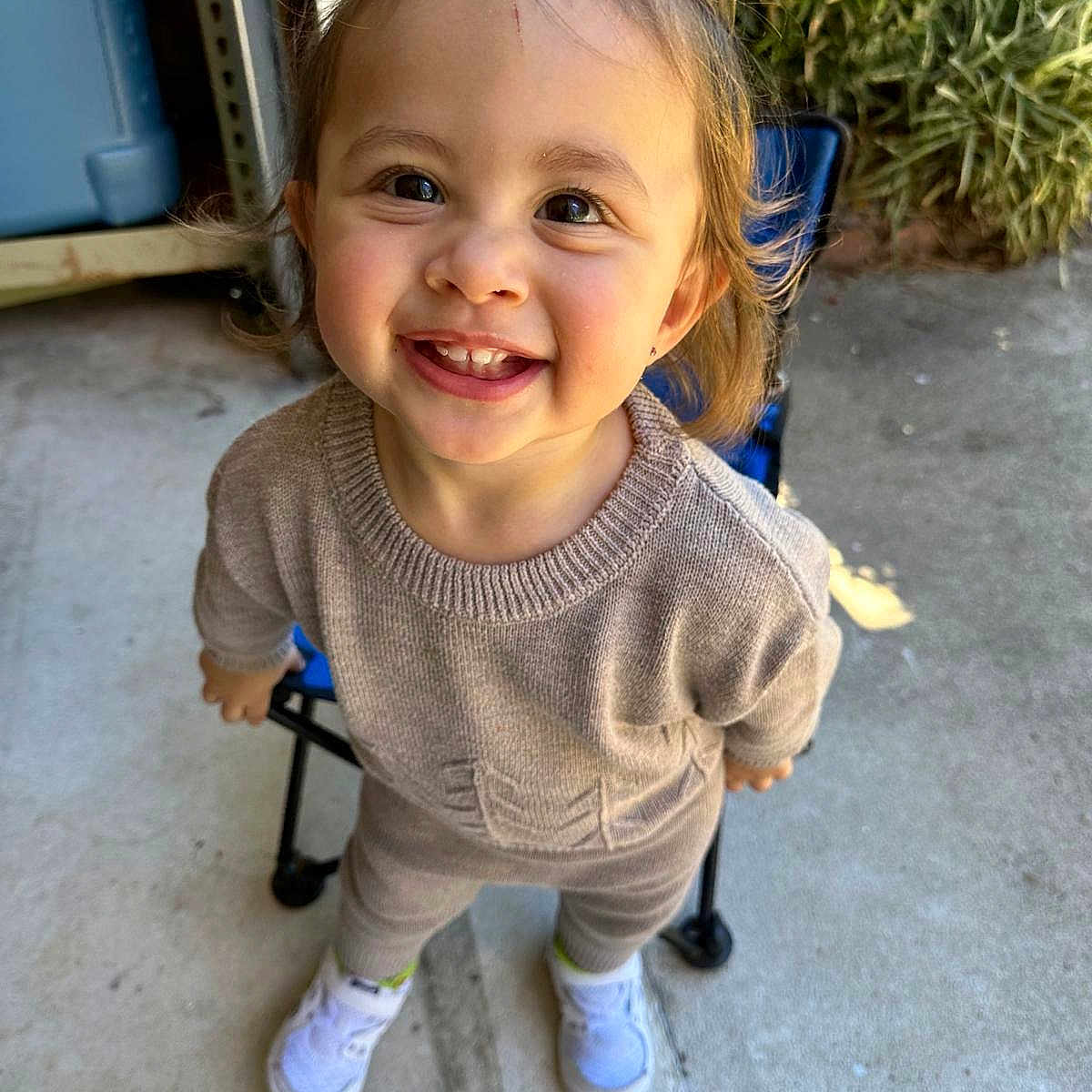 Juliette is registered to the contest to win money with this photo: bodypart, child, city, clothing, face, female, footwear, girl, happy, head, mouth, person, photography, portrait, road, shoe, smile, street, teeth, urban