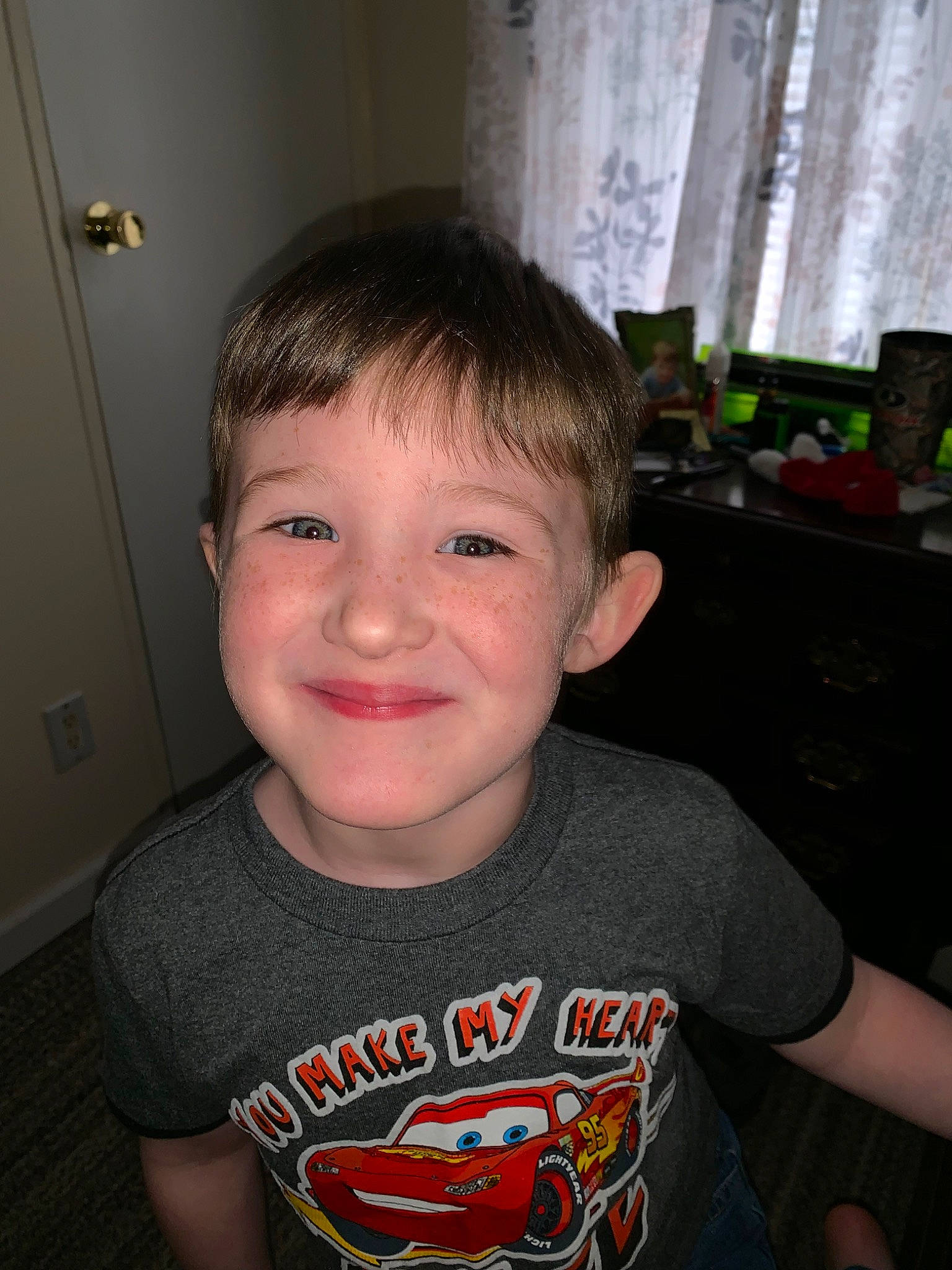 Camron is registered to the contest to win money with this photo: cheek, child, chin, cool, ear, eye, face, facial_expression, forehead, fun, hairstyle, head, jaw, joy, mouth, nose, organ, person, smile, t_shirt