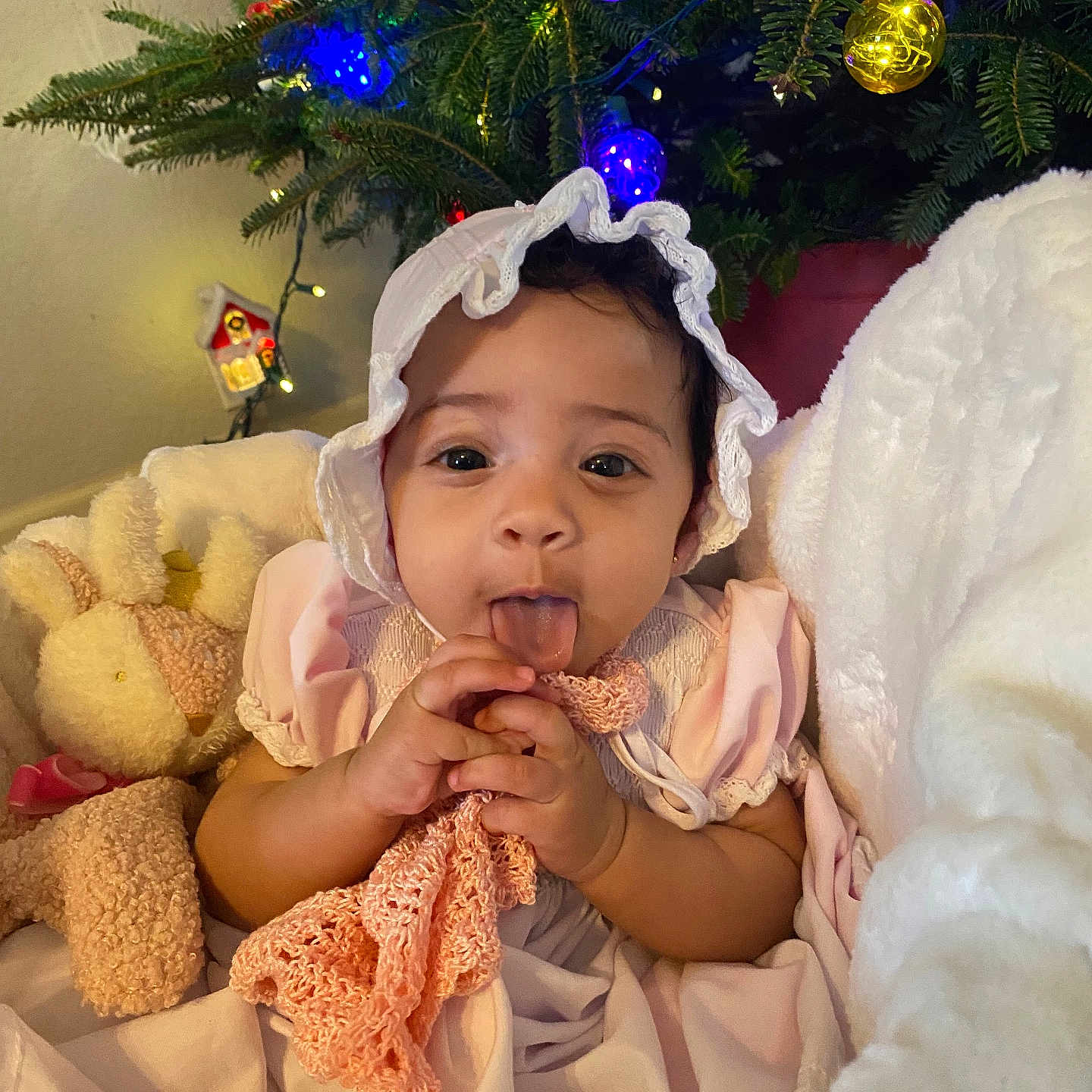 Olivia is registered to the contest to win money with this photo: accessories, baby, blanket, bonnet, clothing, costume, couch, eating, face, festival, food, furniture, hat, head, lighting, person, photography, plant, portrait, tree