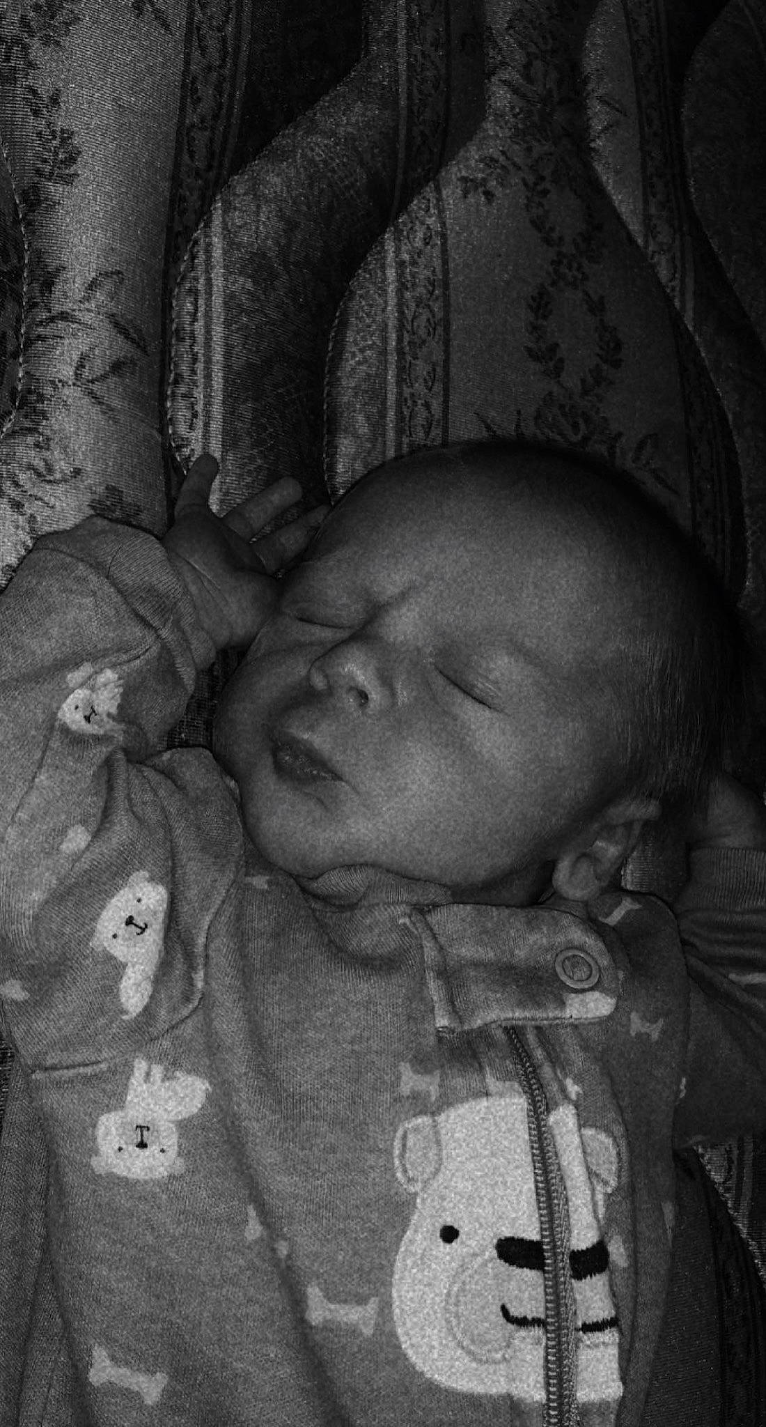 Conner is registered to the contest to win money with this photo: baby, black, black_and_white, cheek, chin, comfort, eye, eyebrow, face, forehead, gesture, hairstyle, head, human_body, iris, lip, mouth, nose, person, skin