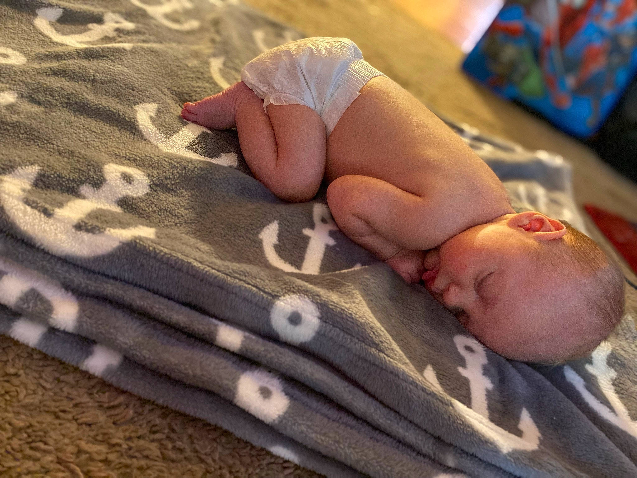 Greysen is registered to the contest to win money with this photo: baby, baby_toddler_clothing, barefoot, beauty, child, comfort, diaper, finger, foot, glasses, hand, human_leg, knee, linens, pattern, person, skin, textile, thigh, toddler