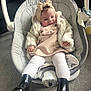 Havana joined the competition — help win amazing prizes! baby, infant, child, baby_rocker, clothing, boots, headband, tights, jacket, dress, hand, carpet, footwear, seat, indoor, cute, smiling, person, fashion, comfort