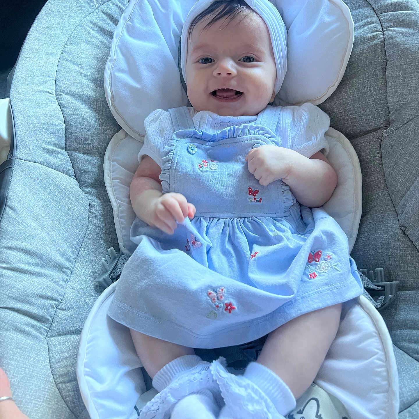 Havana joined the competition — help win amazing prizes! baby, baby_accessory, baby_clothing, baby_seat, blue_dress, bunny_ears, child, closeup, cute, happy, headband, indoor, infant, padded_seat, person, portrait, smiling, socks, soft_lighting, young_child