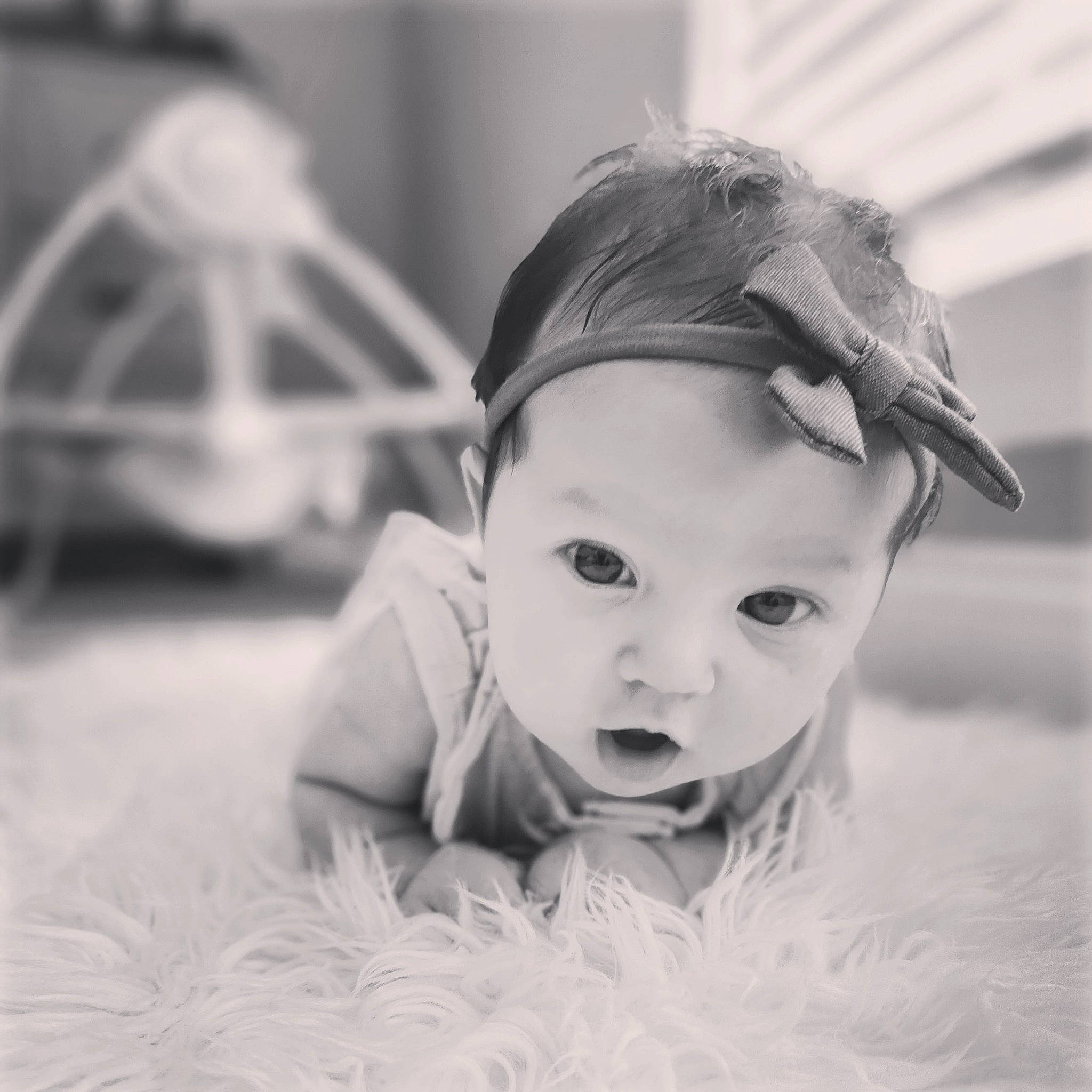 Layana is registered to the contest to win money with this photo: arm, baby, black_and_white, child, ear, eyelash, flash_photography, flooring, fun, grass, happy, human_body, iris, monochrome, monochrome_photography, nose, person, sitting, smile, style