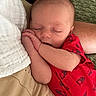 arm, baby, blanket, closed_eyes, comfort, couch, cozy, cute, fabric, hand, indoors, infant, newborn, peaceful, person, portrait, red_onesie, resting, skin, sleeping
