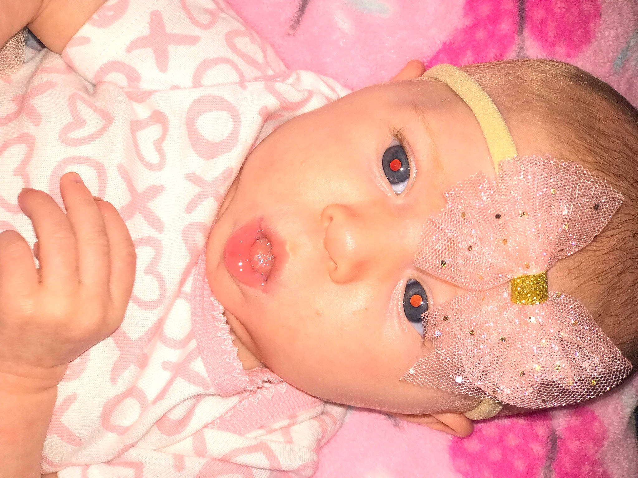 Meredith is registered to the contest to win money with this photo: baby, baby_toddler_clothing, cheek, child, chin, eye, eyebrow, eyelash, finger, gesture, human_body, iris, lip, mouth, muscle, nose, organ, person, pink, skin