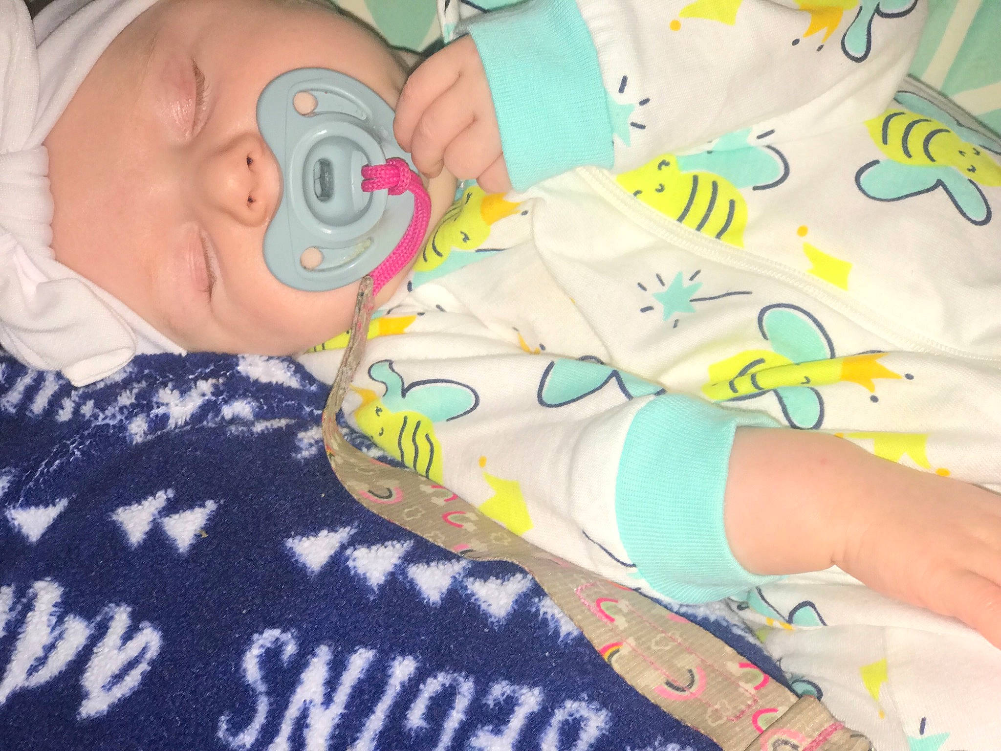 Meredith is registered to the contest to win money with this photo: art, baby, baby_products, baby_toddler_clothing, child, comfort, finger, foot, hat, human_leg, linens, nail, pattern, person, plastic, room, textile, toddler, visual_arts