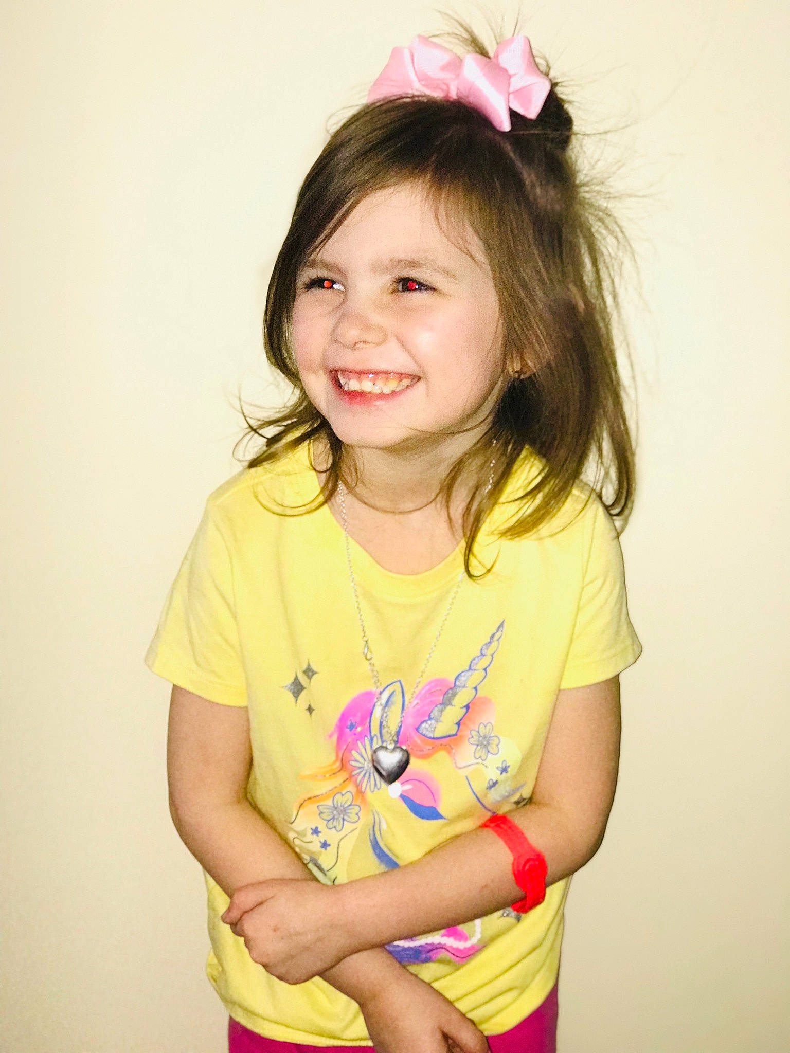 Amelia is registered to the contest to win money with this photo: arm, cheek, child, dress, eye, eyelash, forehead, gesture, happy, human_body, iris, joy, magenta, neck, person, pink, shoulder, skin, sleeve, smile