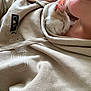 Wuigi is registered to the contest to win money with this photo: animal, closeup, comfort, cozy, cute, face, fur, hoodie, indoor, kitten, person, pet, pink_nose, relaxing, resting, sleeping, snuggling, soft, warm, young