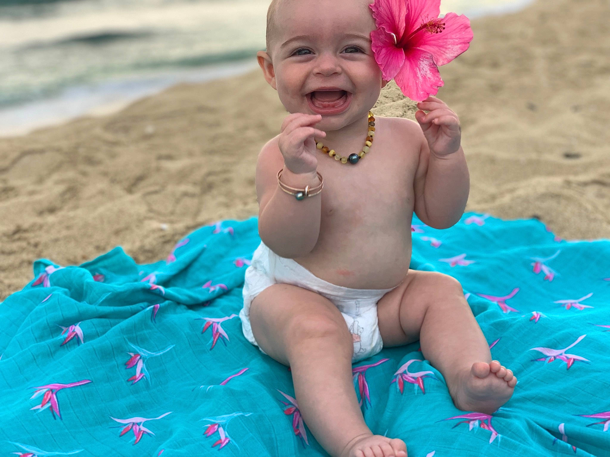 Annika joined the competition — help win amazing prizes! aqua, baby, baby_products, baby_toddler_clothing, child, fashion_accessory, fun, headgear, leisure, person, pink, play, product, skin, smile, summer, sun_tanning, toddler, turquoise, vacation