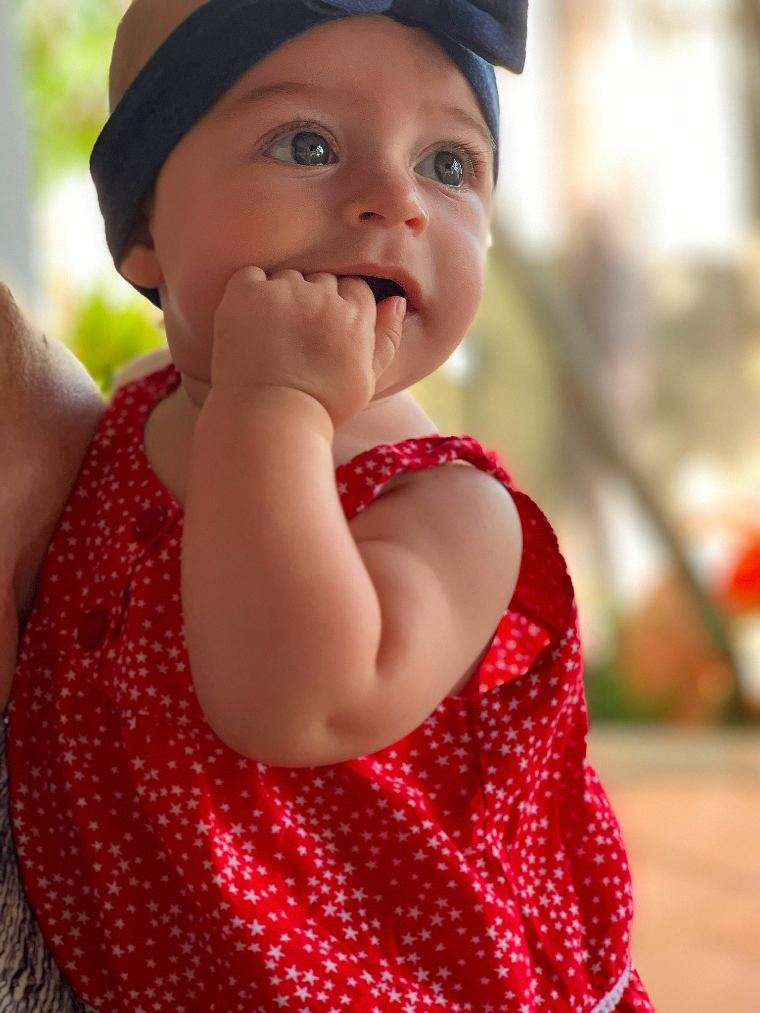 Annika joined the competition — help win amazing prizes! baby, child, finger, hand, happy, headgear, lip, nose, pattern, person, photography, red, skin, smile, sun_hat, toddler
