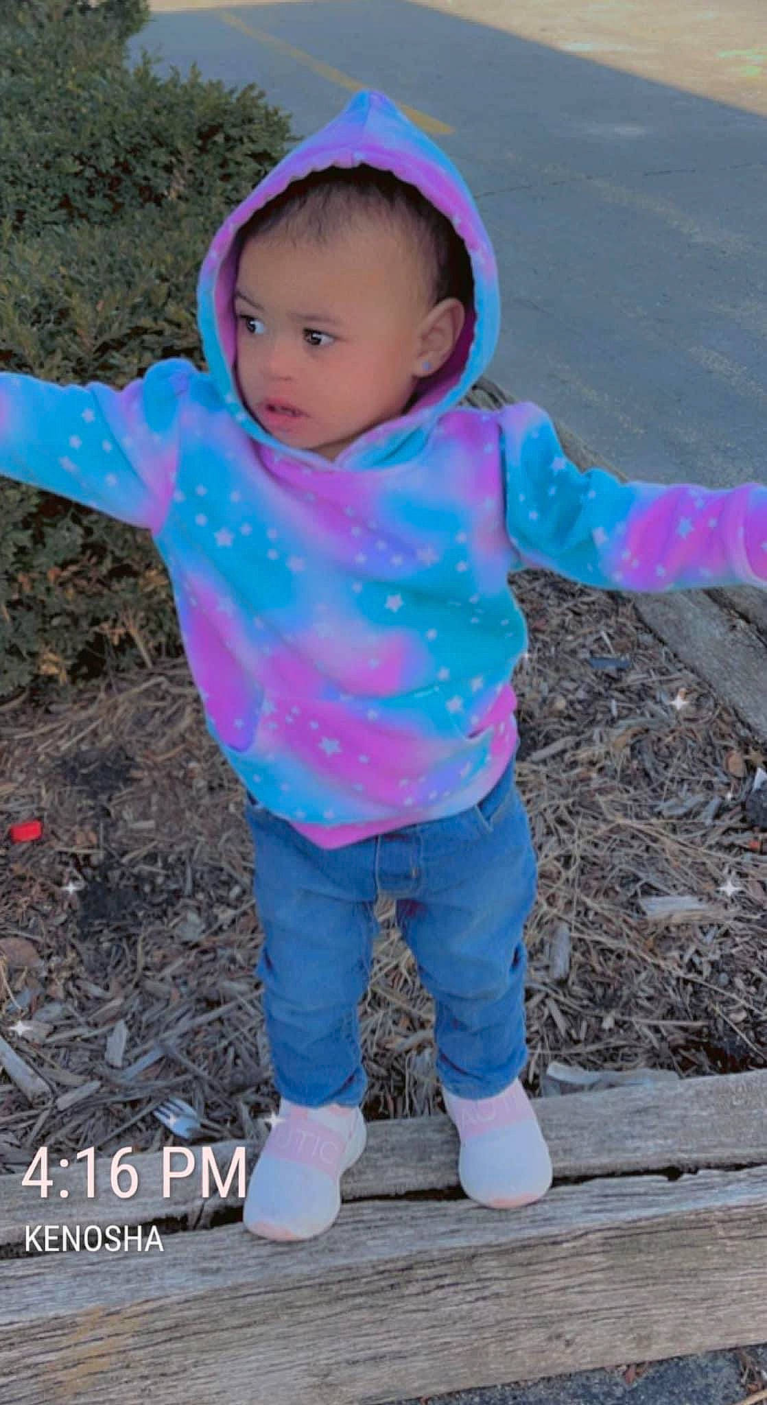 Amiah is registered to the contest to win money with this photo: baby, baby_toddler_clothing, child, electric_blue, fashion_accessory, fun, grass, happy, leisure, magenta, people_in_nature, person, pink, play, purple, recreation, sleeve, soil, t_shirt, toddler