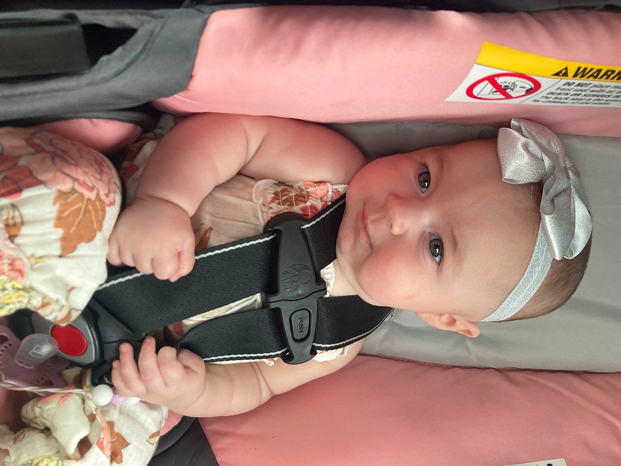 Adrianna is registered to the contest to win money with this photo: auto_part, baby, baby_carriage, baby_products, baby_toddler_clothing, car_seat, cheek, child, fashion_accessory, finger, fun, hat, mouth, nail, people, person, sitting, skin, thumb, toddler