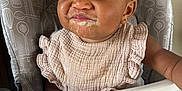 Jocelyn joined the competition — help win amazing prizes! baby, high_chair, bib, food, messy, smile, face, child, eating, infant, cute, indoor, furniture, clothing, person, happy, portrait, young_child, expression, skin