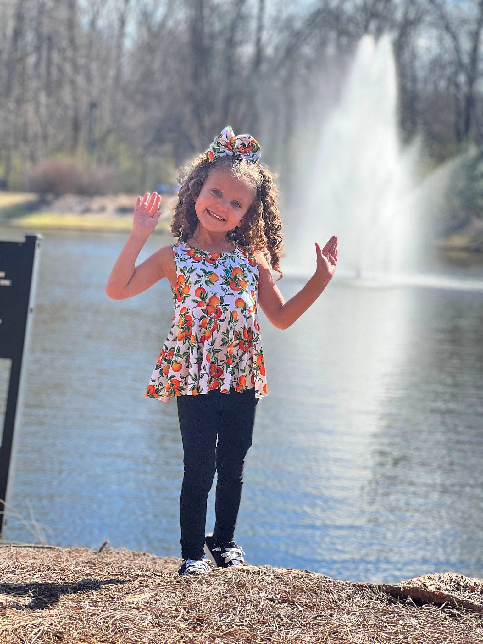 Braylee is registered to the contest to win money with this photo: body_of_water, daytime, eye, flash_photography, gesture, hair, hairstyle, happy, jeans, joy, leisure, nature, people_in_nature, person, sky, smile, standing, street_fashion, sunlight, tree