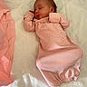 Elara joined the competition — help win amazing prizes! newborn, baby, sleeping, infant, portrait, pink, striped_clothing, swaddled, quilt, mattress, bed, indoors, peaceful, resting, closed_eyes, face, head, textile, newspaper, cozy