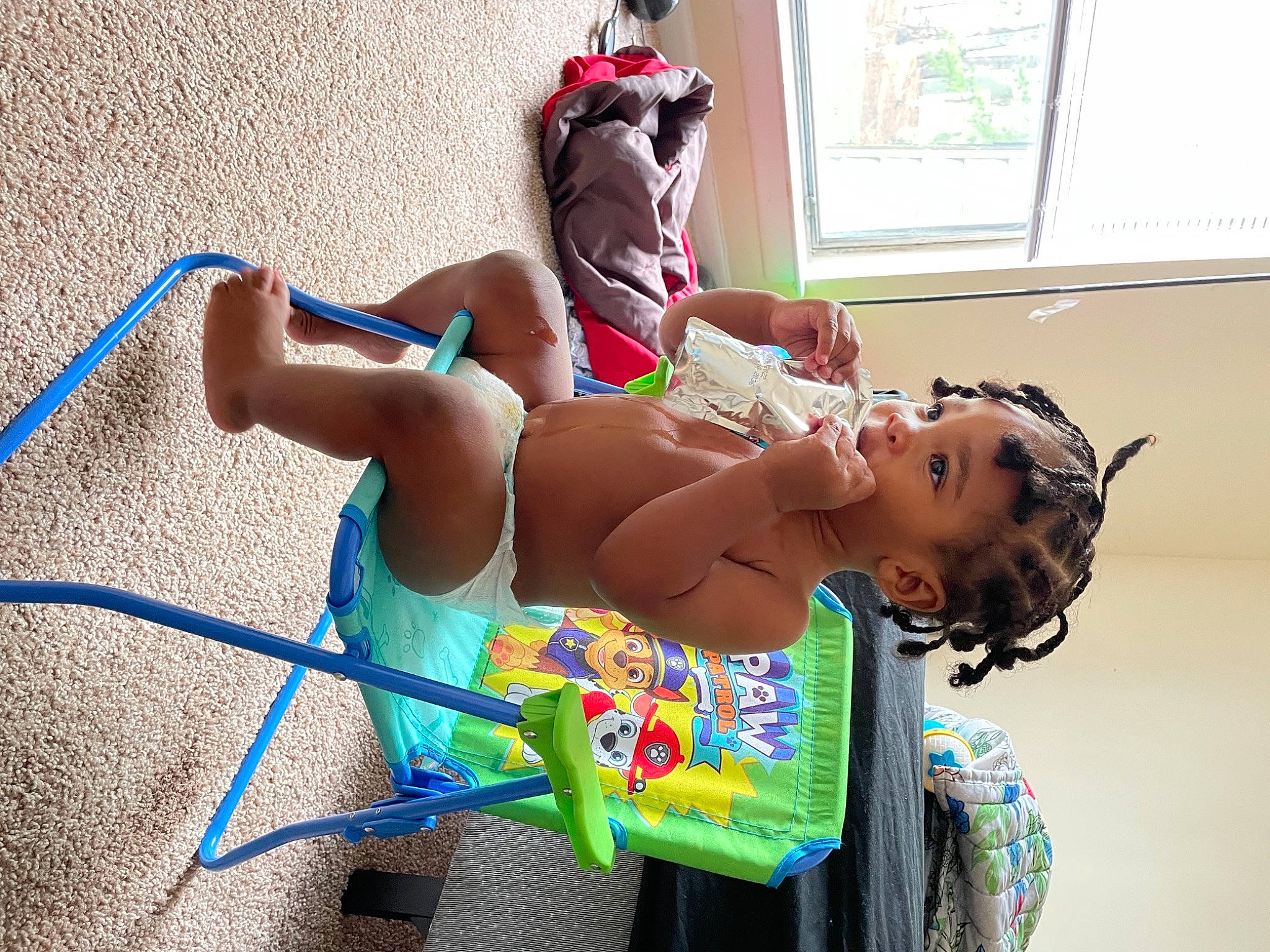 Tyrus is registered to the contest to win money with this photo: abdomen, barechested, chest, child, fashion_design, foot, fun, happy, human_leg, knee, leisure, person, play, recreation, sitting, thigh, tire, toddler, trunk, wheel