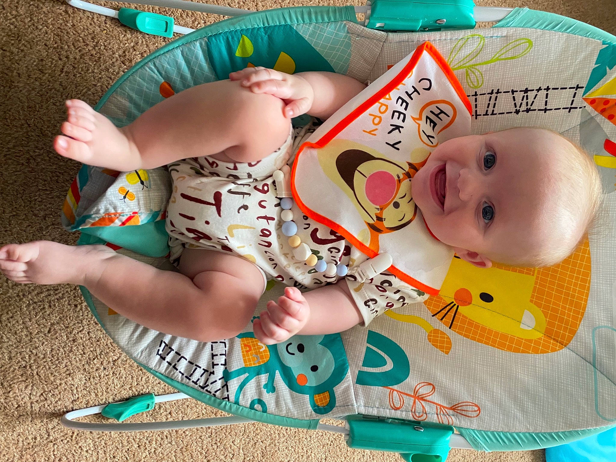 Charlie is registered to the contest to win money with this photo: baby, baby_products, baby_toddler_clothing, cheek, child, facial_expression, finger, foot, happy, human_body, human_leg, joy, leg, linens, mammal, person, photograph, skin, textile, thigh