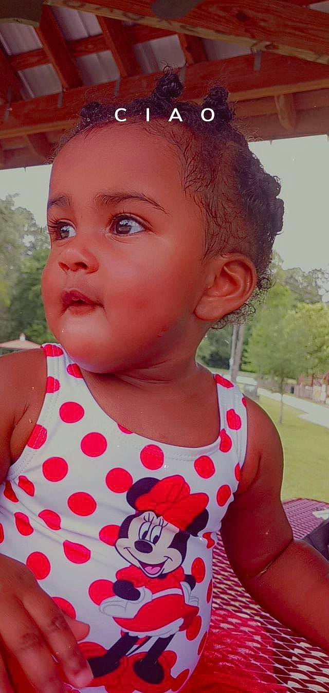 Kaisley is registered to the contest to win money with this photo: baby, baby_toddler_clothing, cheek, eyelash, face, fun, grass, hairstyle, happy, lip, mouth, neck, nose, organ, person, pink, plant, skin, sleeve, summer