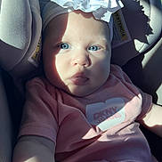 Hannah joined the competition — help win amazing prizes! baby, child, blue_eyes, headband, flower, car_seat, sunlight, shadow, pink_clothing, bracelet, infant, portrait, closeup, cute, young, person, seatbelt, fabric, indoors, soft_light