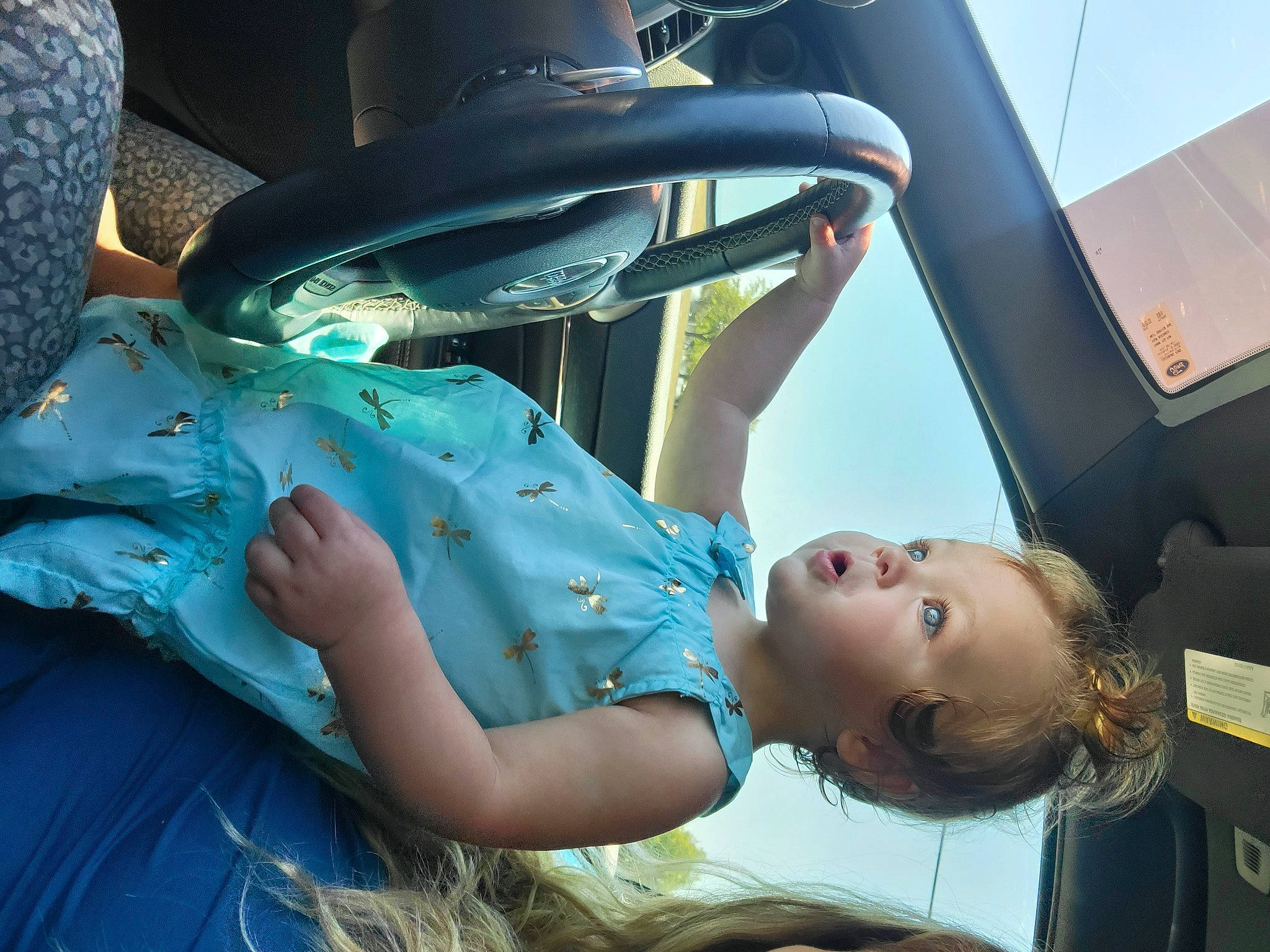 Ellery is registered to the contest to win money with this photo: arm, auto_part, automotive_design, automotive_exterior, automotive_lighting, black_hair, dress, elbow, electric_blue, flash_photography, fun, hand, happy, human_body, human_leg, leisure, motor_vehicle, person, thigh, vehicle_door