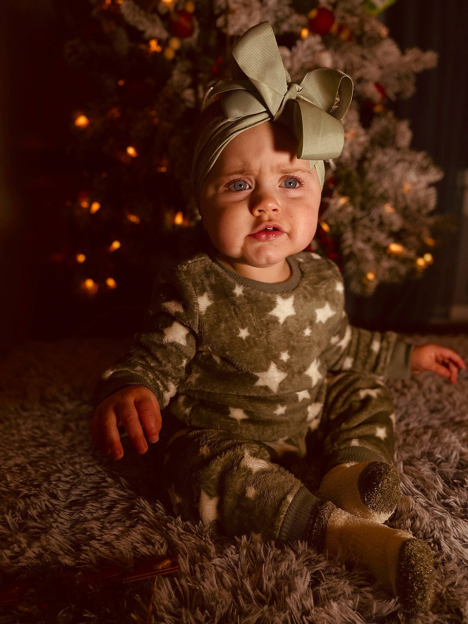 Dallas is registered to the contest to win money with this photo: baby, baby_toddler_clothing, child, christmas_ornament, christmas_tree, costume_hat, event, eye, flash_photography, fun, grass, hairstyle, happy, head, headwear, people_in_nature, person, plant, toddler, tree