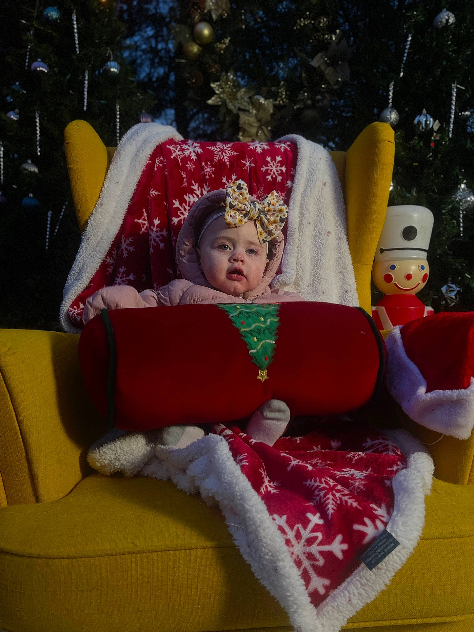 Dallas is registered to the contest to win money with this photo: carmine, christmas, christmas_decoration, christmas_eve, comfort, couch, decoration, event, fictional_character, happy, headwear, holiday, interior_design, lap, leisure, ornament, person, room, santa_claus, sitting