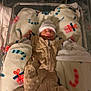 newborn, baby, sleeping, bassinet, hospital, blanket, hat, sleep_sack, infant, cozy, holiday, candy_cane, gift, bed, soft, wrapped, child, cute, peaceful, indoors
