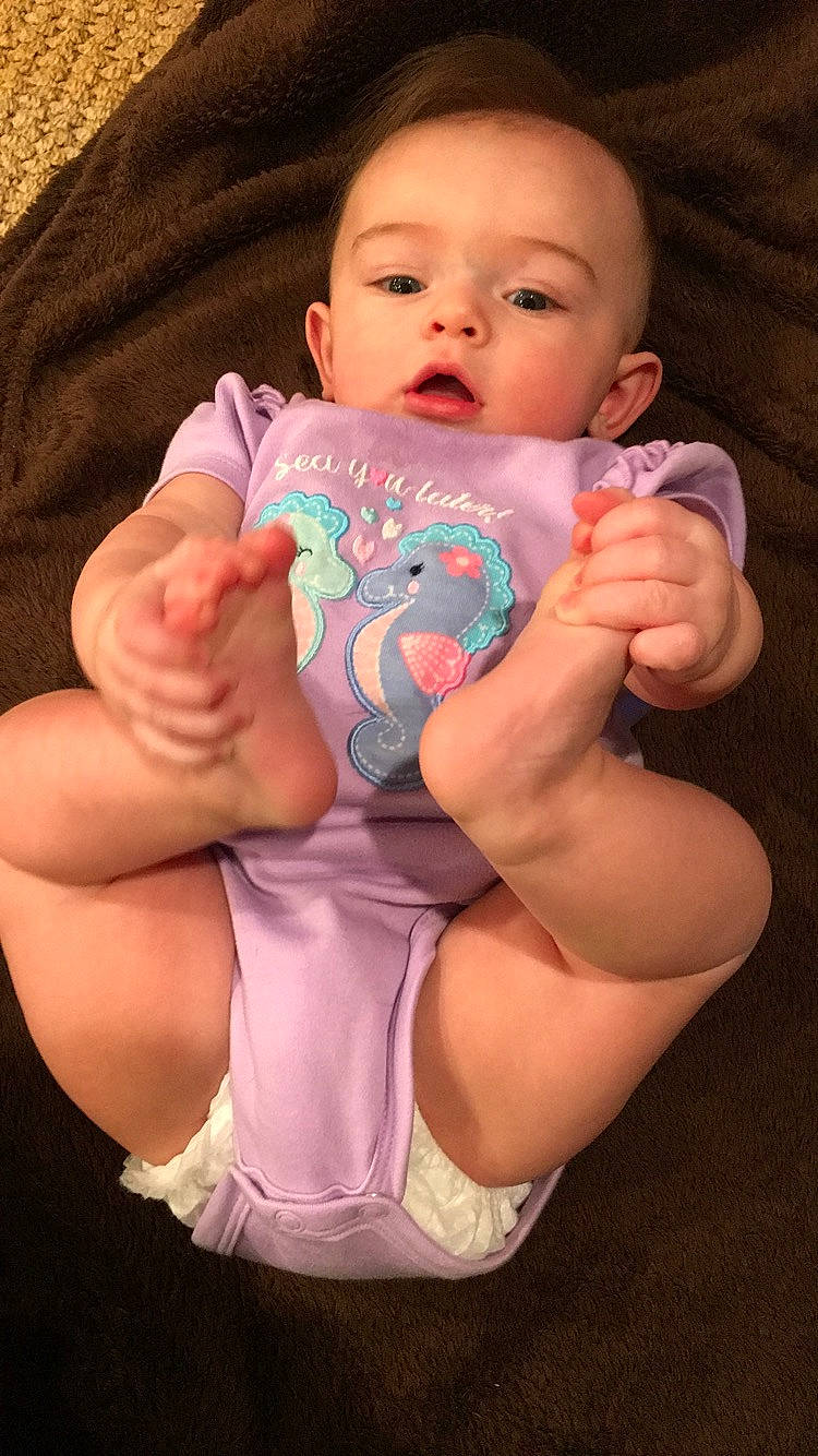 Reyna is registered to the contest to win money with this photo: baby, baby_products, baby_toddler_clothing, cheek, child, diaper, finger, foot, hand, huggies_pull_ups, leg, mouth, person, pink, product, skin, sole, thigh, thumb, toddler