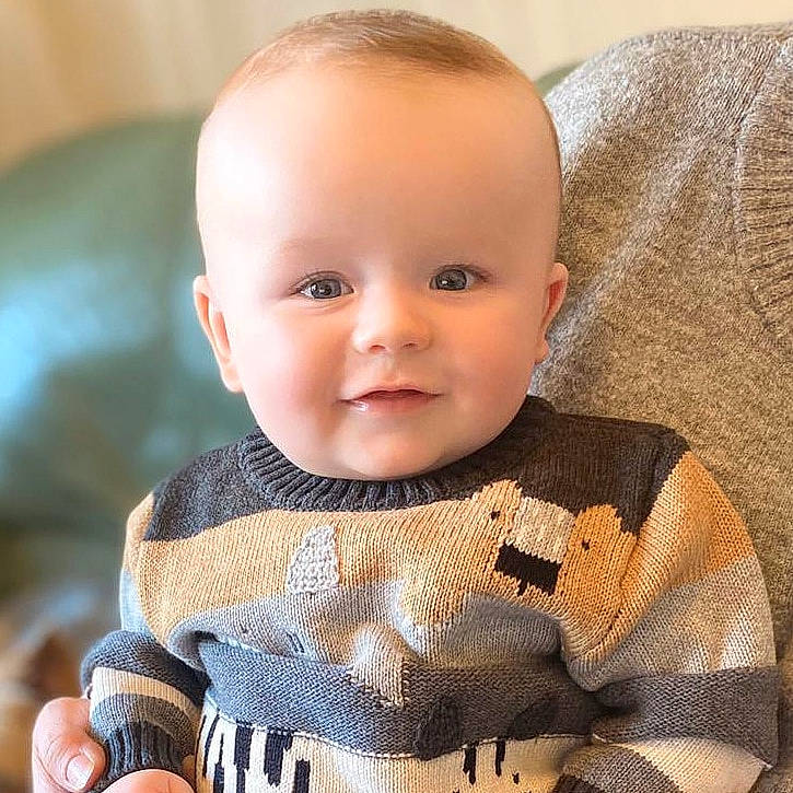 Lucca joined the competition — help win amazing prizes! baby, baby_toddler_clothing, cheek, child, eye, face, head, joy, nose, outerwear, person, product, skin, sleeve, sweater, toddler, top