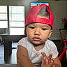 Luam joined the competition — help win amazing prizes! baby, toddler, child, portrait, face, serious, red_cap, backward_hat, white_shirt, sitting, hands, indoors, living_room, windows, sunlight, furniture, table, chair, toy, photography